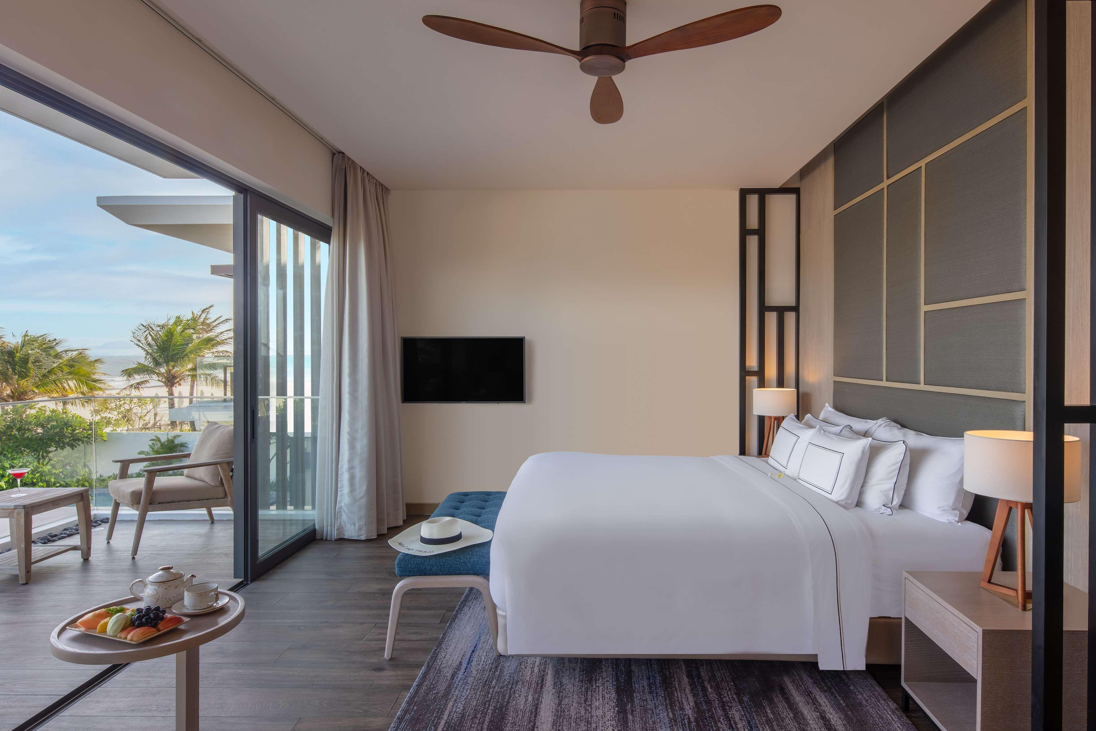Melia Ho Tram Beach Resort Bagian luar foto A bedroom at the hotel